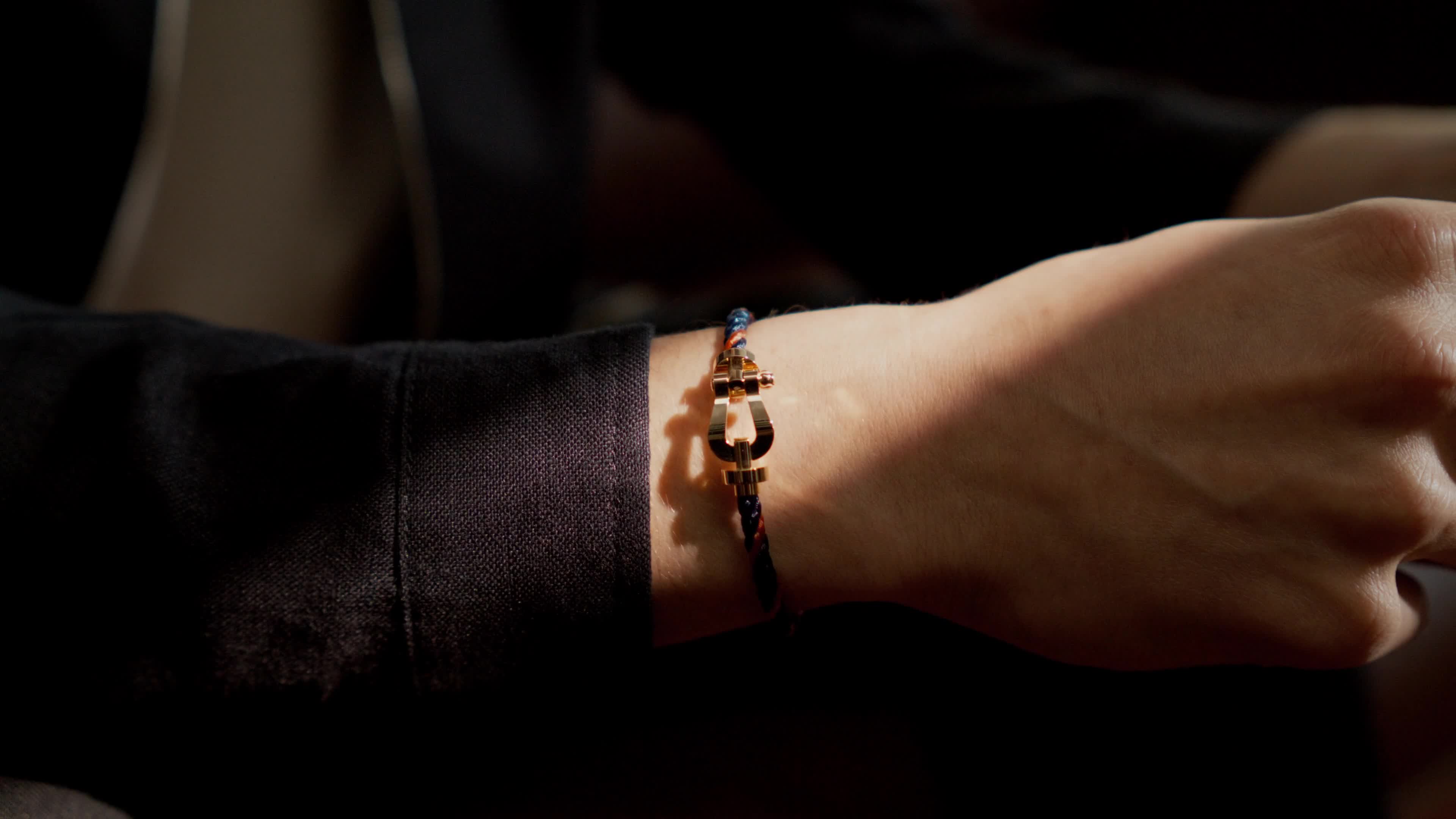 A FRED Force 10 bracelet from the Roland-Garros capsule, worn on the wrist